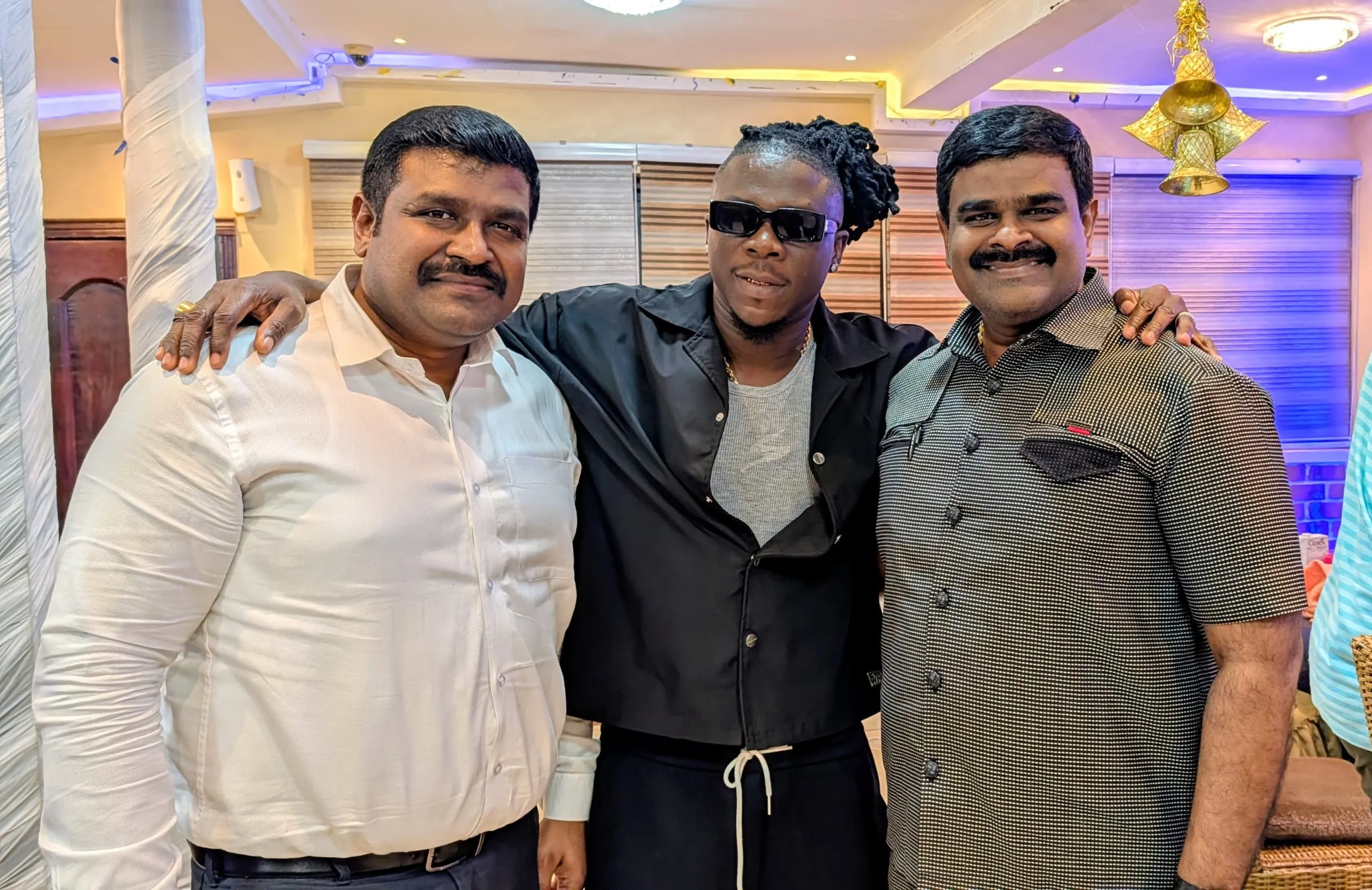 Ghanian musician Stonebwoy alongside Kingdom Exim executives James Kwame Rajamani, James Rajamani, James Gnanaraj Rajamani, and Immanuel Rajamani